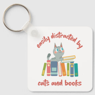 Porte-clés Facilement distrait par les chats et les livres