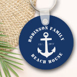 Porte-clés Family Name Beach House Nautical Boat Anchor Navy<br><div class="desc">A stylish Keychain with your personalized family name and beach house, lake house, or other desired text. Features a custom designed nautical boat anchor in white on classic navy blue or easily customize the base color to match your current decor or theme. Great for accenting the keys to your family's...</div>