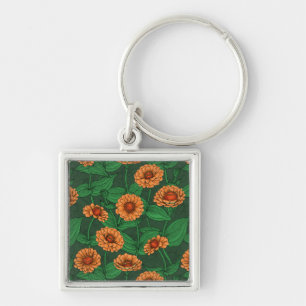 Porte-clés Fleurs Zinnia orange, feuilles verts sur vert fonc