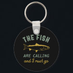 Porte-clés Funny Fishing Quote The Fish Are Calling I Must Go<br><div class="desc">Funny and humorous design for fisherman, angler, those who love river and lake fishing. This vintage, retro and distressed merchandise is great to wear on your fishing trip to the cabin by the wood. Bring your gears, fishing rod, fishing reel and let's catch some fish. Great Christmas gift and birthday...</div>