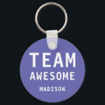 Porte-clés Funny Team Awesome Purple Personalized Name<br><div class="desc">Funny Team Awesome Purple Personalized Name Keychain features the text "Team Awesome" with your personalized name below on a purple background. Personalize by editing the text in the text box provided. Designed for you by ©Evco Studio www.zazzle.com/store/evcostudio</div>
