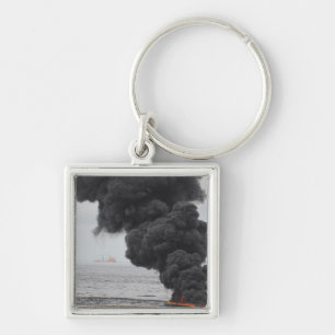 Porte-clés Gathered a concentré des brûlures d'huile