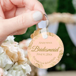 Porte-clés Gold Frills on Coral Peach Bridesmaid Wedding Gift<br><div class="desc">These keychains are designed to give as favors to bridesmaids in your wedding party. They feature a simple yet elegant design with a pale coral peach or light orange colored background, gold script lettering, and a lacy golden faux foil floral border. The text says "Bridesmaid" with space for her name,...</div>