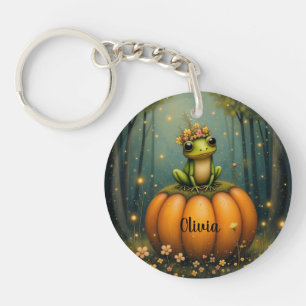 Porte-clés grenouille assise sur une citrouille