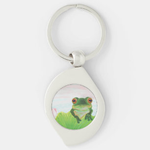 Porte-clés Grenouille verte derrière le porte - clé métalliqu