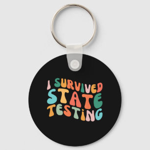 Porte-clés I Survie State Testing Design Student State Test