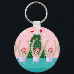 Porte-clés Illustration de nageurs artistiques personnalisés<br><div class="desc">Illustration moderne cool de nageuses artistiques synchronisées dans un bassin avec un sapin de Noël et des étoiles à l'arrière. Les nageurs artistiques offrent un design cadeau dans des couleurs pastel. Cinq femmes nageuses en piscine. cadeau d'équipe de natation cool. cadeaux d'équipe de natation synchronisée, cadeau d'entraîneur d'équipe de natation...</div>