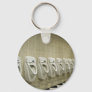 Porte-clés intérieur de toilettes avec la rangée d'urinoir