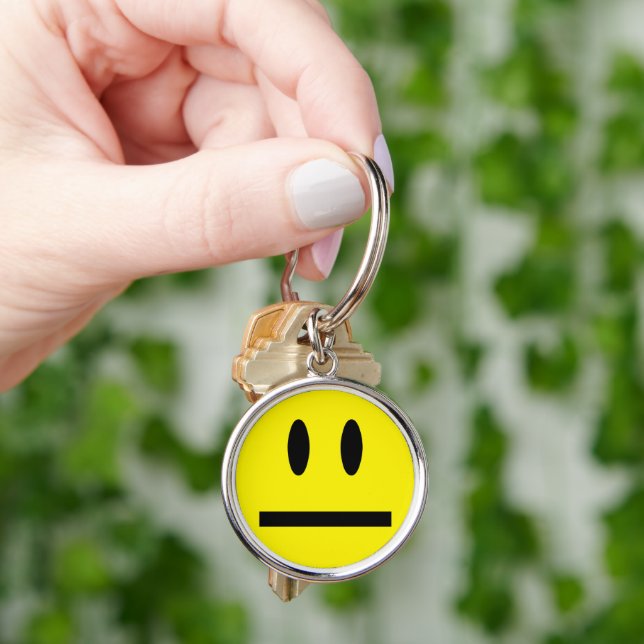 Porte-clés Jaune brillant et joyeux visage souriant (main)