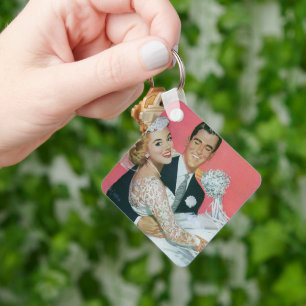 Porte-clés Jeune couple de mariés, le marié portant la mariée