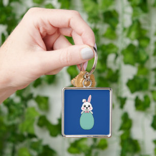 Porte-clés Joli lapin blanc tenant l'oeuf de Pâques
