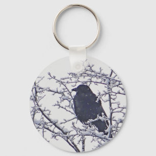 Porte-clés Joli oiseau noir en branches enneigées