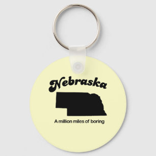 Porte-clés La devise du Nebraska - Un million de miles ennuye