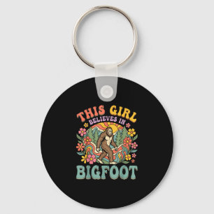 Porte-clés La fille Bigfoot croit au coucher de soleil floral