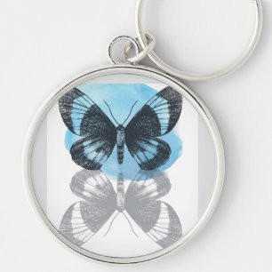Porte-clés La magie des papillons bleus.