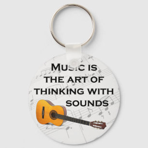 Porte-clés La musique pense avec son guitare