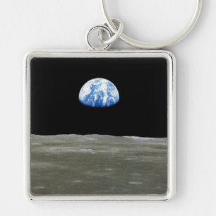Porte-clés La Terre depuis la Lune dans l'espace noir : lever