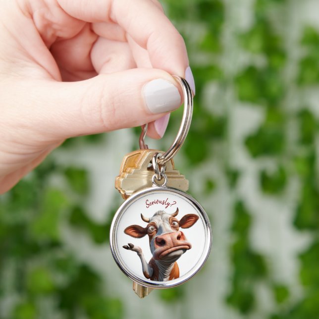 Porte-clés La vache sotte - "Sérieusement ?" Conception amusa (main)