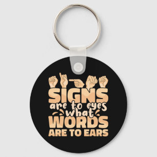 Porte-clés Les signes sont pour les yeux ce que les mots sont