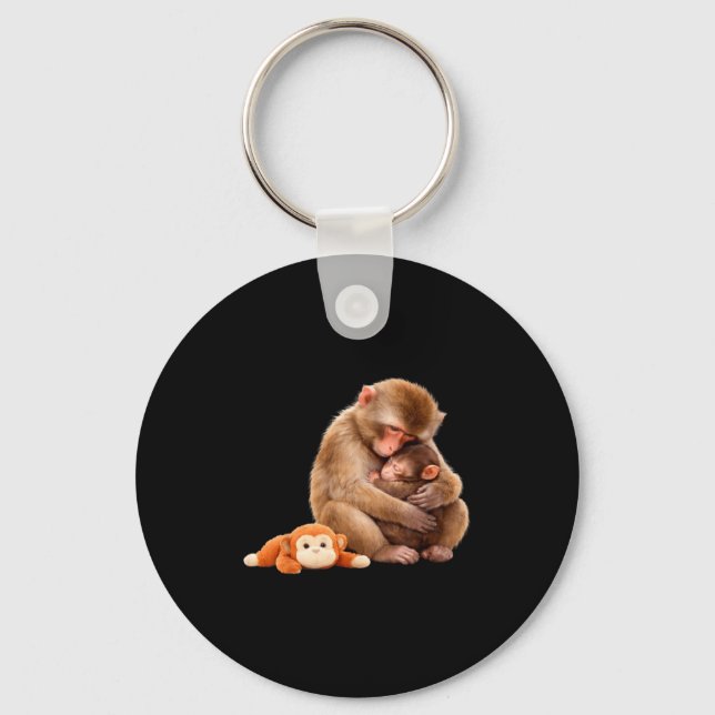 Porte-clés Mème de singe qui frappe en câlinant une peluche (Recto)