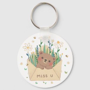 Porte-clés MISS U : Ours et fleurs en peluche dans l'envelopp
