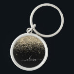Porte-clés Monogramme de nom girly script paillettes noir or<br><div class="desc">Chaînes à clé de monogramme de nom de script de paillettes de scintillement noir et or (chaîne de clé). Cela fait le cadeau parfait pour un anniversaire des 16 ans, un mariage, une douche de mariée, un anniversaire, une douche de bébé ou une fête de bachelorette pour quelqu'un qui aime...</div>