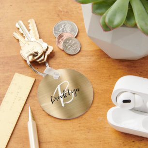 Porte-clés Monogramme en métal brossé or noir et blanc 