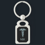Porte-clés Monogramme Turquoise Caduceus<br><div class="desc">Turquoise Porte - clé Caduceus prêt pour vous à personnaliser. Un grand cadeau pour toute personne dans le domaine médical. ⭐ Ce Produit est 100% Personnalisable. Les graphiques et / ou le texte peuvent être ajoutés, supprimés, déplacés, redimensionnés, changés autour, tournés, etc... 99% de mes designs dans mon magasin sont...</div>