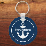 Porte-clés Nautical Navy Blue Personalized Boat Name Anchor<br><div class="desc">Round nautical keychain design features a simple,  stylish navy blue and white coastal style design with boat anchor accent. Personalize the custom script text with the name of your boat.</div>