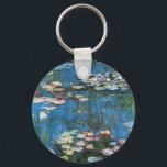 Porte-clés Nénuphars de Claude Monet, Impressionnisme Vintage<br><div class="desc">Nénuphar (1914) de Claude Monet est une peinture de nature impressionniste vintage. Une des nombreuses variations de peintures florales de nénuphars que Monet peint par l'étang dans son jardin fleuri à Giverny, France. À propos de l'artiste : Claude Monet (1840-1926) est un fondateur du mouvement de peinture impressionniste française, dont...</div>