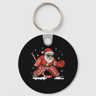 Porte-clés Noël jouant au gardien de but de hockey sur glace