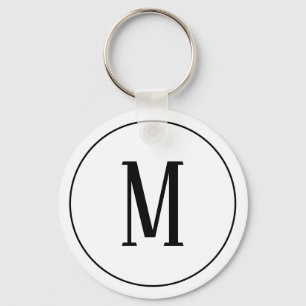 Porte-clés Noir de monogramme sur le porte - clé blanc