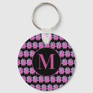 Porte-clés Noirs décorés d'un monogramme et dentellent quat