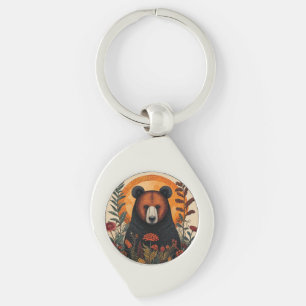 Porte-clés Ours artistique parmi des fleurs botaniques vibran