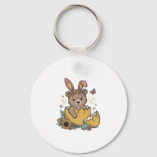 Porte-clés Ours de Pâques mignon dans un œuf cassé Vecteur vi