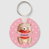 Ours en peluche mignon portant un coeur rouge