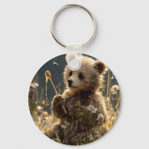 Porte-clés Ourson avec du miel dans une prairie de fleurs sau