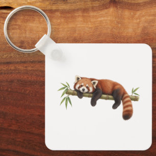 Porte-clés Panda roux se reposant sur du bambou