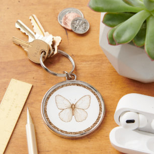 Porte-clés Papillon blanc pailleté faux or