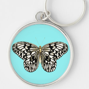 Porte-clés Papillon noir et blanc, arrière - plan turquoise