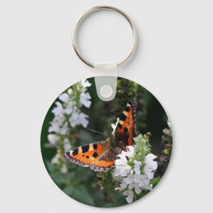 Porte-clés Papillon orange et fleurs blanches