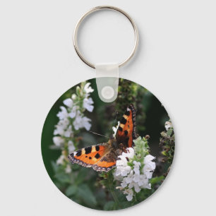 Porte-clés Papillon orange et noir sur Fleurs blanches
