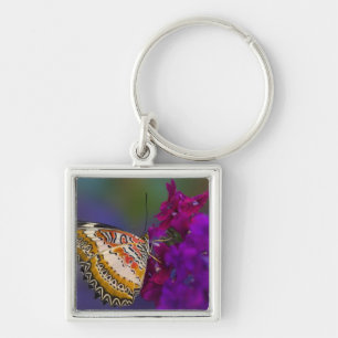 Porte-clés Papillon Tropical sur Fleurs Violettes