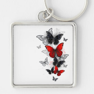 Porte-clés Papillons noirs et rouges volants