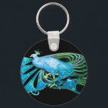 PORTE-CLÉS PEACOCK EN TURQUASE BLEUE ET NOIR<br><div class="desc">Design numérique par Bulgan Lumini. Partie de la nouvelle collection ARCADIA.</div>