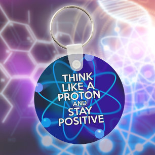 Porte-clés Pensez comme un proton et restez positif Citation