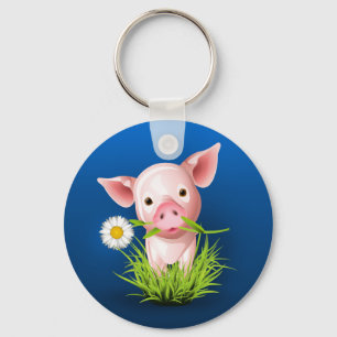 Porte-clés Petit cochon rose dans l'herbe verte sur le bleu
