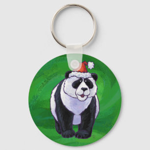 Porte-clés Petit panda en chapeau de Père Noël sur fond vert