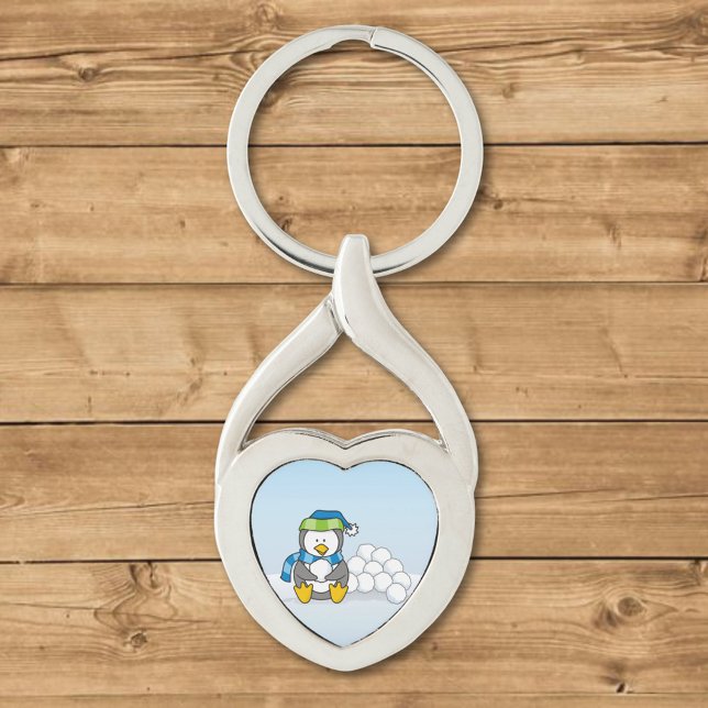 Porte-clés Petit pingouin assis avec des boules de neige (Créateur téléchargé)