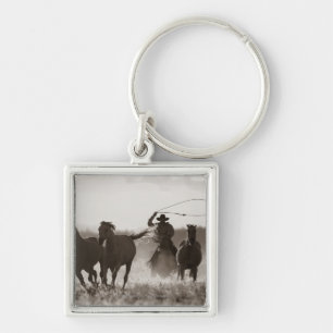 Porte-clés Photo noire et blanche des chevaux d'un Lassoing